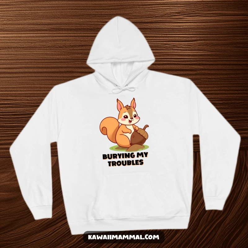 Funny kawaii squirrel, focused on burying a huge acorn, depicted on a cozy hoodie, bringing woodland humor.