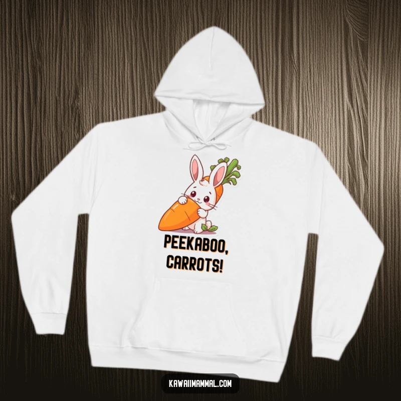 Funny rabbit peeking from behind a giant carrot, featured on a cozy hoodie for warm, humorous comfort.