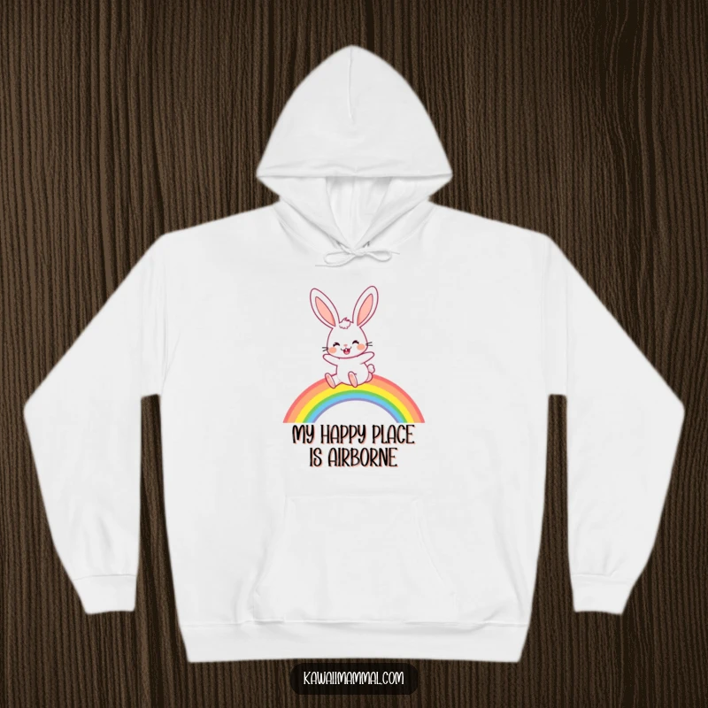 Funny Hoodie: A joyful rabbit with long, floppy ears hops over a rainbow, perfect for staying cozy and spirited.