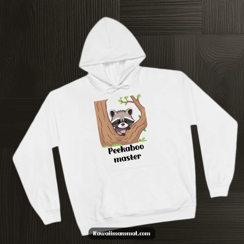 Funny hoodie depicting a curious raccoon peeking out from behind a tree, perfect for cozy days.